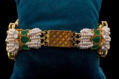 Round Shaped bracelet with green stone work by Khaitan Jewels