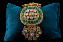 Round Shaped bracelet with green stone work by Khaitan Jewels